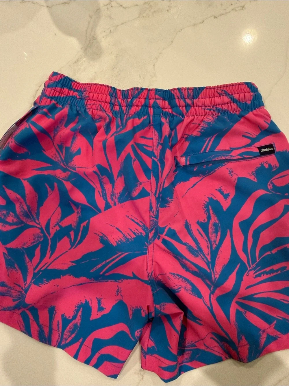 chubbies Kids Swim Trunks in Hot Pink and Royal Blue Tropical Leaf Print